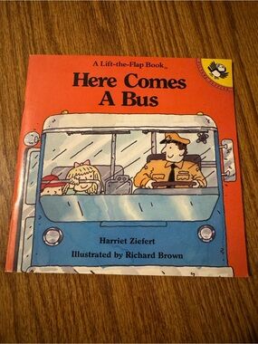 A Lift-the-Flap Book “Here Comes A Bus” by Harriet Ziefert